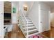 Elegant staircase with hardwood treads and white risers leading to the second floor at 475 Highland Gate Cir, Suwanee, GA 30024