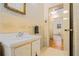 Bathroom featuring a sink, decorative wallpaper, and natural light at 2436 Hazelwood Ne Dr, Atlanta, GA 30345