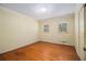 Bedroom featuring hardwood floors and natural light from two windows at 2436 Hazelwood Ne Dr, Atlanta, GA 30345