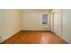 Bedroom with hardwood floors, a window letting in natural light, and closet storage at 2436 Hazelwood Ne Dr, Atlanta, GA 30345