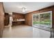 Open-concept kitchen area with a breakfast bar and sliding glass doors at 2436 Hazelwood Ne Dr, Atlanta, GA 30345