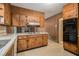 Well-equipped kitchen with wood cabinets and black appliances at 2436 Hazelwood Ne Dr, Atlanta, GA 30345