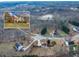 Aerial view of a two-story home close to a lake with mature trees providing a serene and picturesque setting at 2800 Jona Trl, Dacula, GA 30019