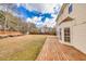 Large grassy backyard with a wooden deck and a fenced perimeter at 2800 Jona Trl, Dacula, GA 30019