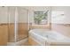 Elegant bathroom featuring jacuzzi bathtub and shower at 2800 Jona Trl, Dacula, GA 30019