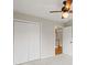 Bedroom featuring carpet floors, a ceiling fan, and closet space for storage at 2800 Jona Trl, Dacula, GA 30019