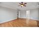 Primary bedroom with hardwood floors, trey ceiling and access to bathroom at 2800 Jona Trl, Dacula, GA 30019