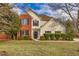 Inviting two-story home featuring a blend of brick and siding exterior with manicured landscaping at 2800 Jona Trl, Dacula, GA 30019