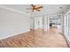 Open concept floor plan featuring hardwood floors and a view of the kitchen at 2800 Jona Trl, Dacula, GA 30019