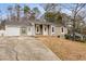 Charming single-story home with stone accents, covered entry, attached garage, and a well-maintained front yard at 4053 Overland Trl, Snellville, GA 30039