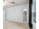 Carpeted main bedroom featuring neutral walls, windows, and en-suite bathroom access at 4053 Overland Trl, Snellville, GA 30039