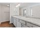 Bathroom with dual sinks, granite countertops, and grey cabinets for a clean modern look at 11204 Cornerstone Way, Hampton, GA 30228
