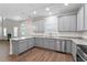 Bright kitchen with granite countertops, stainless appliances, and ample cabinet space at 11204 Cornerstone Way, Hampton, GA 30228