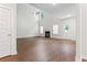 Open living room with high ceilings, fan, fireplace, and natural light at 11204 Cornerstone Way, Hampton, GA 30228