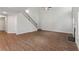 Spacious living room with staircase, fireplace, and modern flooring at 11204 Cornerstone Way, Hampton, GA 30228