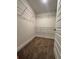 Walk-in closet featuring carpet and metal shelving at 11204 Cornerstone Way, Hampton, GA 30228