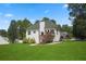 This home has a bright back exterior with a deck and large backyard at 136 Huntcliff Trl, Ellenwood, GA 30294
