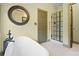 Charming bathroom with a soaking tub, walk-in shower, and classic fixtures at 136 Huntcliff Trl, Ellenwood, GA 30294