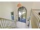 Grand foyer with a beautiful arched doorway and stylish decor creating an inviting entrance at 136 Huntcliff Trl, Ellenwood, GA 30294