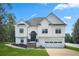 A charming two-story home with a well-maintained front yard and inviting entrance at 136 Huntcliff Trl, Ellenwood, GA 30294