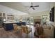 Open concept living room and kitchen with modern design, fireplace, and abundant natural light at 136 Huntcliff Trl, Ellenwood, GA 30294