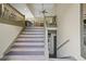 Stylish staircase leading to the upper level, showcasing modern design and architectural details at 136 Huntcliff Trl, Ellenwood, GA 30294