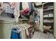 Organized walk-in closet with ample hanging space, shelving, and shoe storage at 136 Huntcliff Trl, Ellenwood, GA 30294