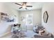 Modern home office with glass desk, neutral-toned walls, and natural light at 3808 Jack Vernon Cir, Powder Springs, GA 30127