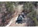 Aerial view of the property, showcasing the house, driveway, and surrounding trees at 9001 East Carroll Rd, Winston, GA 30187