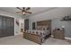 Inviting bedroom featuring neutral colors, ceiling fan, dresser, bedside table and attached bath at 9001 East Carroll Rd, Winston, GA 30187