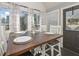 Cozy breakfast nook with a farmhouse table, views of the outdoors, and 'welcome' wreath on the door at 9001 East Carroll Rd, Winston, GA 30187