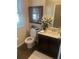 Bathroom with cream walls, framed picture, a commode and single sink at 171 Gorham Gates Dr, Hiram, GA 30141