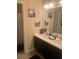 Bathroom with double vanity, framed mirrors, neutral paint, decorative accents, and a shower/tub combination at 171 Gorham Gates Dr, Hiram, GA 30141