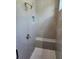 Modern bathroom shower with gray subway tile and a built in seat at 3032 Farm Tract Trl, Woodstock, GA 30189