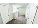 Upstairs hallway with neutral walls and carpet, leading to various rooms at 4417 Belcamp Rd, Fairburn, GA 30213