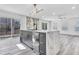 Island kitchen with marbled countertops, stainless steel drawers and a modern open design at 5292 Greenway Dr, Villa Rica, GA 30180