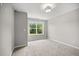 Cozy bedroom featuring a large window with a lush backyard view at 1101 Cooks Farm Way, Woodstock, GA 30189