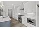 Modern kitchen featuring quartz countertops, stainless steel oven and appliances at 1101 Cooks Farm Way, Woodstock, GA 30189