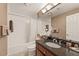 Cozy bathroom showcasing a shower-tub, dark countertop and great lighting at 1302 River Green Nw Dr # 1302, Atlanta, GA 30327