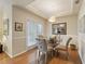 Cozy dining room with wood floors, natural light, and a modern light fixture at 1302 River Green Nw Dr # 1302, Atlanta, GA 30327