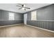 Bedroom with chair railing, neutral walls, and a ceiling fan at 391 Mount Zion Sw Rd, Atlanta, GA 30354