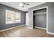 Comfortable bedroom featuring laminate flooring, fresh paint, a ceiling fan and closet at 391 Mount Zion Sw Rd, Atlanta, GA 30354