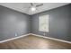 Cozy bedroom with neutral walls, laminate flooring, and a ceiling fan at 391 Mount Zion Sw Rd, Atlanta, GA 30354