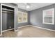 Bright bedroom featuring laminate flooring, fresh paint, two windows and a closet at 391 Mount Zion Sw Rd, Atlanta, GA 30354