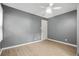 A cozy bedroom with a ceiling fan and light wood-look flooring at 391 Mount Zion Sw Rd, Atlanta, GA 30354