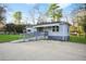 Well-maintained single story home with ramp, large driveway, and partially fenced yard at 391 Mount Zion Sw Rd, Atlanta, GA 30354