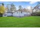 A side view of the home with a lush green lawn at 391 Mount Zion Sw Rd, Atlanta, GA 30354