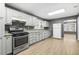 A well-lit kitchen features light cabinets and stainless steel appliances at 391 Mount Zion Sw Rd, Atlanta, GA 30354