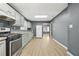 A well-lit kitchen features light cabinets and appliances at 391 Mount Zion Sw Rd, Atlanta, GA 30354