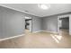 Open floor plan living room featuring laminate floors and neutral color walls at 391 Mount Zion Sw Rd, Atlanta, GA 30354